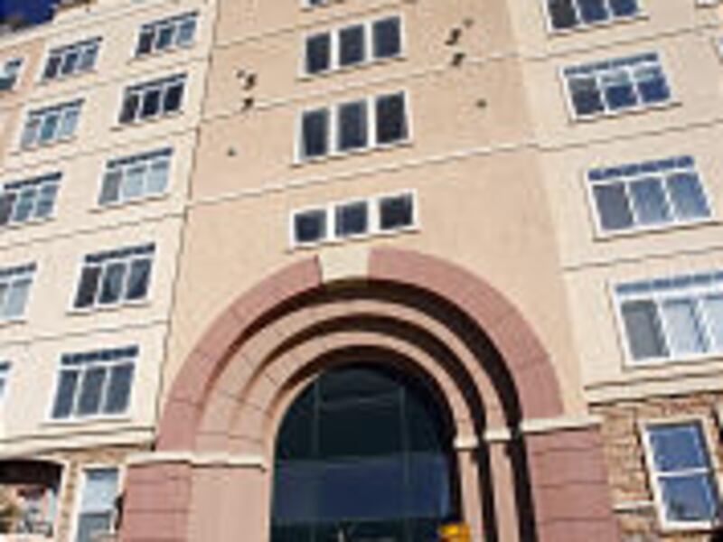 A resident enters the Northgate Apartments at the Gateway. The LDS Church is planning similiar apartments in the downtown area.
