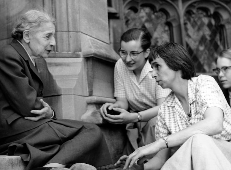 Physicist Lise Meitner with students (Sue Jones Swisher, Rosalie Hoyt and Danna Pearson McDonough) on the steps of the chemistry building at Bryn Mawr College.