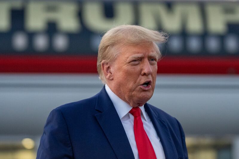 Former President Donald Trump speaks with reporters from Hartsfield-Jackson Atlanta International Airport, on Aug. 24, 2023.