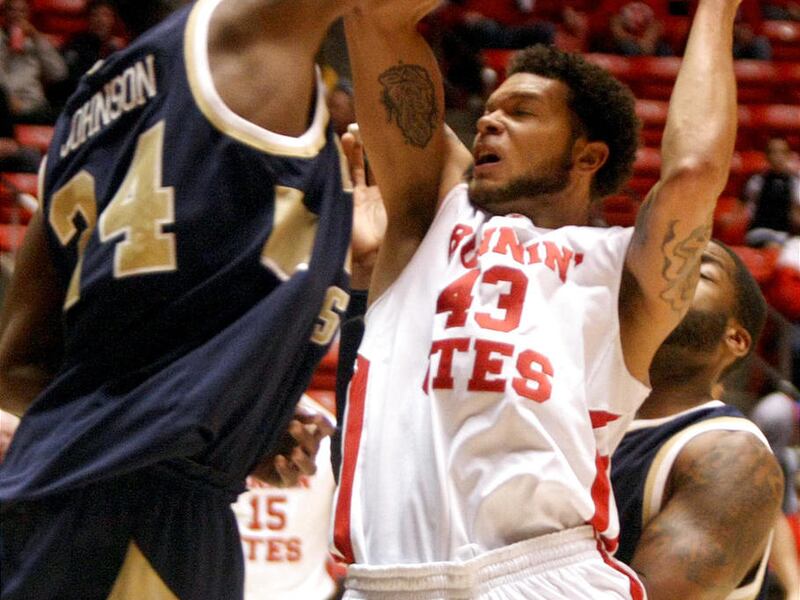 The University of Utah's Cedric Martin shoots over Montana State's Tre Johnson in a mens basketball game at the Huntsman Center in Salt Lake City on Saturday, Nov. 19, 2011.