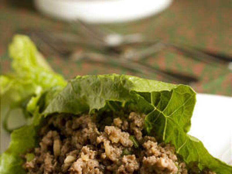 Dinner guests can assemble their own Spicy Beef in Lettuce Cups right at the dinner table.