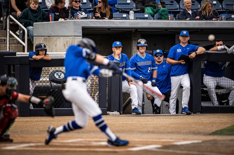 BYU players look on from the dugout during game against Dixie State in Provo on May 12, 2022.