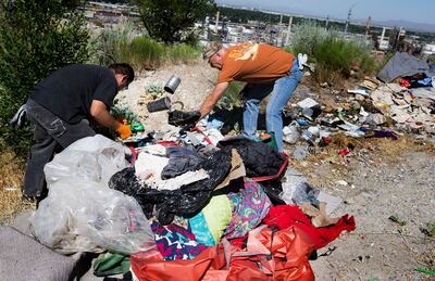 Following reports of illegal camping, excessive litter and human waste, crews with multiple agencies clear out homeless camps located east of Victory Road in the foothills north of Salt Lake City on Thursday, June 14, 2018.