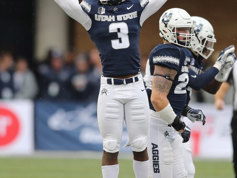 Utah State Aggies safety Jontrell Rocquemore (3) celebrates an interception in Logan on Saturday, Oct. 13, 2018.