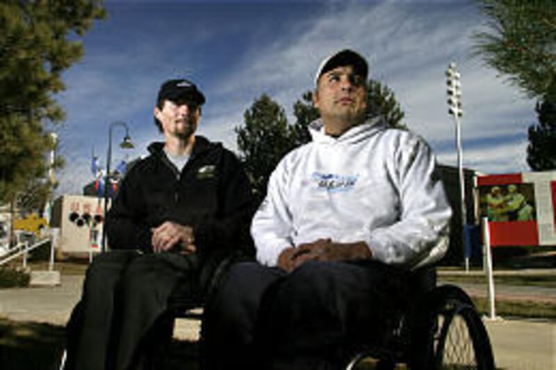 Paralympians Chris Devlin-Young, left, and Joe Tompkins have regained some of their self-worth through racing on U.S. Disabled Ski Team.