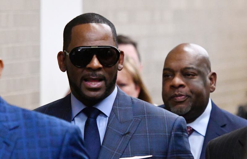 Musician R. Kelly arrives at the Daley Center for a hearing in his child support case at the Daley Center, Wednesday, March 6, 2019, in Chicago. Kelly was charged last month with sexually abusing four females dating back to 1998, including three underage