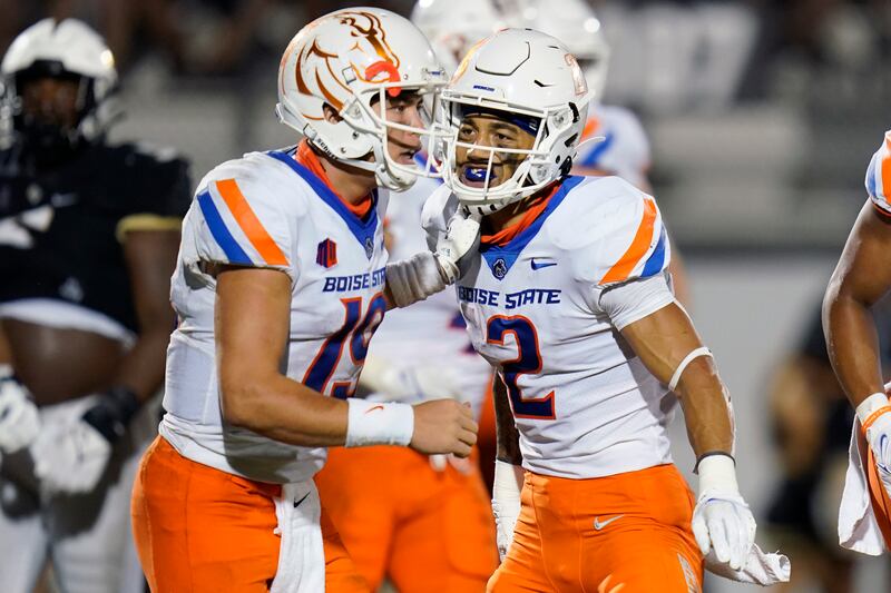Boise State receiver Khalil Shakir (2) and QB Hank Bachmeier celebrate after a 7-yard touchdown pass against Central Florida.