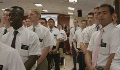 Missionaries await the arrival of President Russell M. Nelson and Elder Dale G. Renlund at a missionary meeting on Sept., 2018, in Santo Domingo, Dominican Republic.