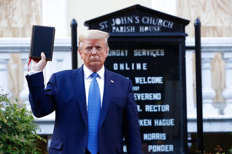 President Donald Trump holds a Bible as he visits outside St. John’s Church across Lafayette Park on June 1, 2020.