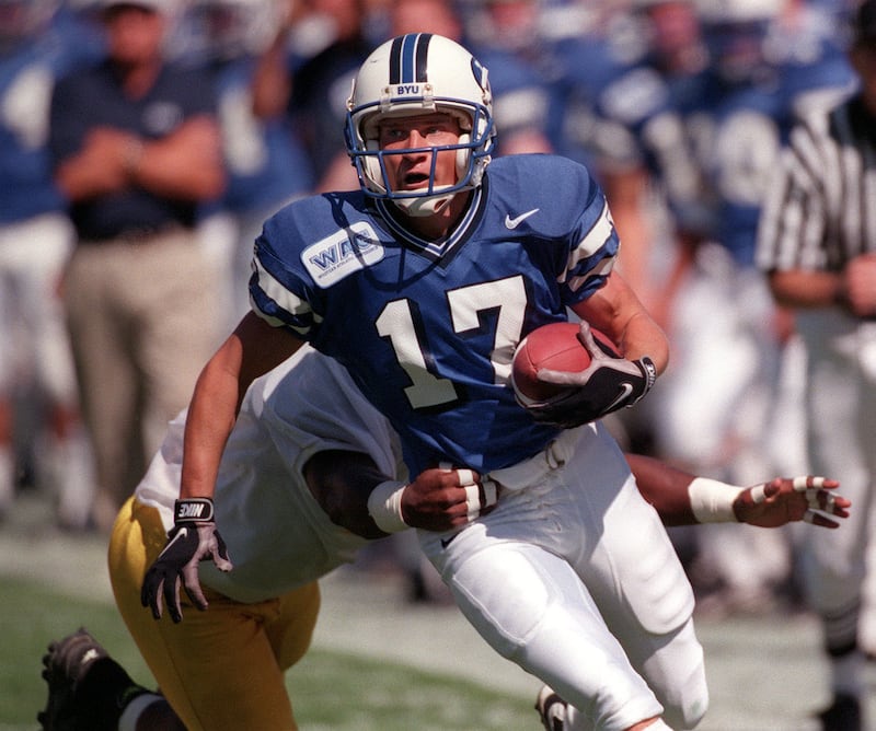 BYU's Aaron Roderick returns a punt as Murray State's Jai Williams tries to tackle him during Saturday's game between BYU and Murray State Saturday Sept. 26, 1998, at Cougar Stadium.