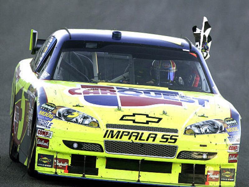 Mark Martin takes a victory lab after winning the NASCAR Sylvania 300 Sprint Cup auto race at New Hampshire Motor Speedway.