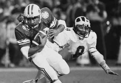 At left, Vai Sikahema of BYU makes a run during the Holiday Bowl in San Diego, California, Dec. 21, 1984.