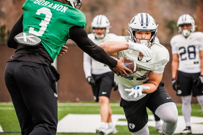 BYU quarterbacks and running backs get in some work during spring camp in Provo on March 14, 2024.