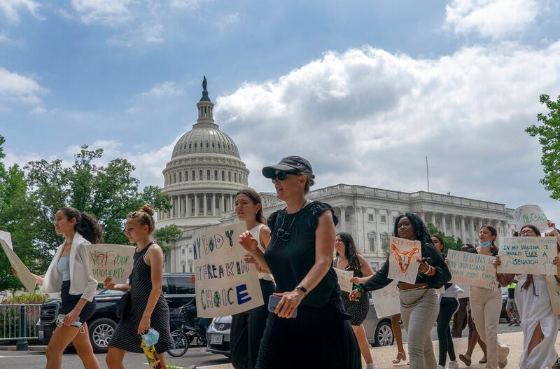 A group of abortion-rights protesters march past the U.S. Capital in Washington on Friday, June 24, 2022.