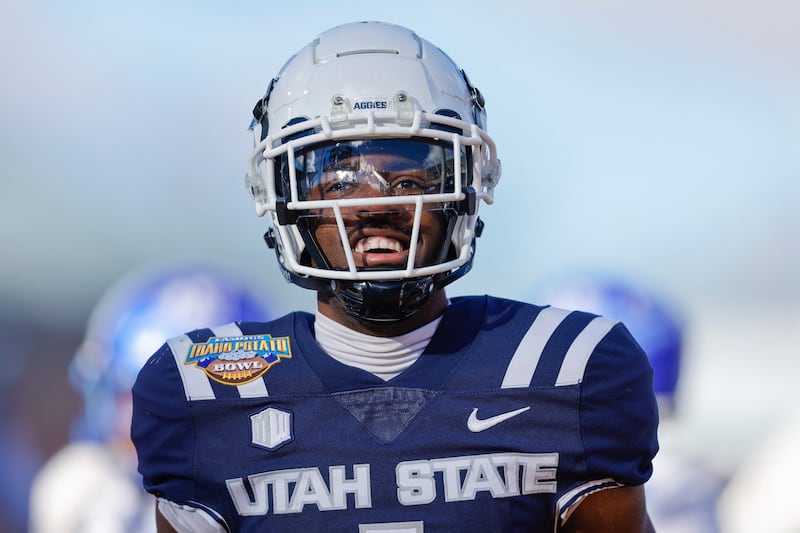 Utah State wide receiver Jalen Royals celebrates after a 35-yard touchdown reception against Georgia State in the Famous Idaho Potato Bowl NCAA college football game, Saturday, Dec. 23, 2023, in Boise, Idaho.