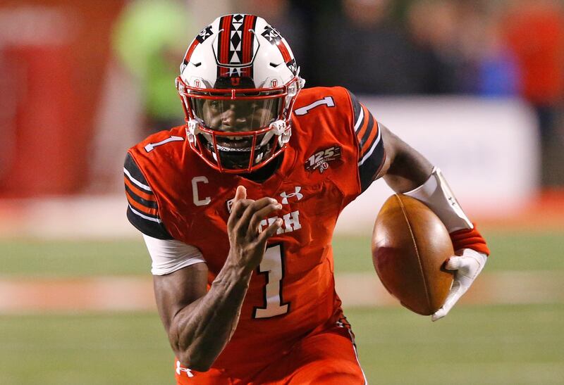 Utah quarterback Tyler Huntley (1) carries the ball against Arizona during the first half of an NCAA college football game Friday, Oct. 12, 2018, in Salt Lake City. (AP Photo/Rick Bowmer)