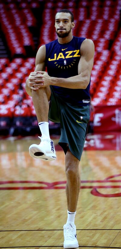 Utah's Rudy Gobert stretches during a pregame practice before taking on the Houston Rockets in Game 5 of a first-round NBA basketball playoff series in Houston on Wednesday, April 24, 2019.