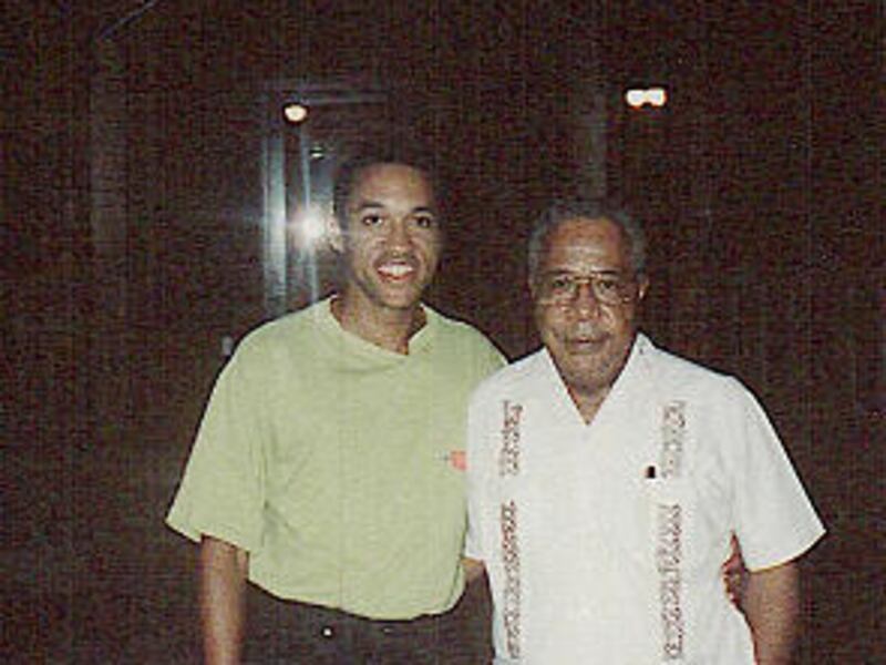 Chris Haley, left, and his uncle, Alex Haley, in 1991. Alex Haley made history by tracing six generations of his family in "Roots."