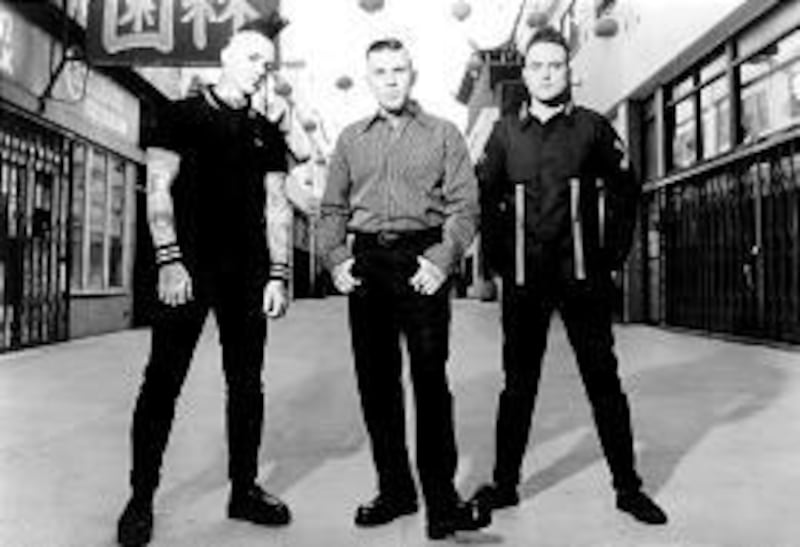 Geoff Kresge, left, Nick 13 and Frank Telles, who goes by the stage name Frank Hell, make up Tiger Army.