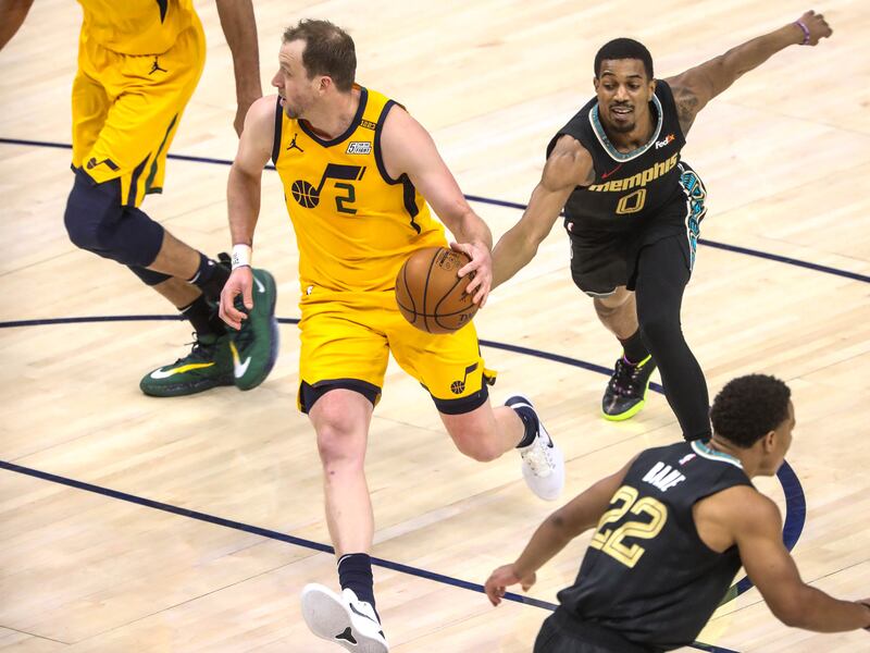 Utah Jazz guard Joe Ingles (2) passes Memphis Grizzlies guard De’Anthony Melton (0) without noticing during a game at Vivint Smart Home Arena in Salt Lake City on Saturday, March 27, 2021.