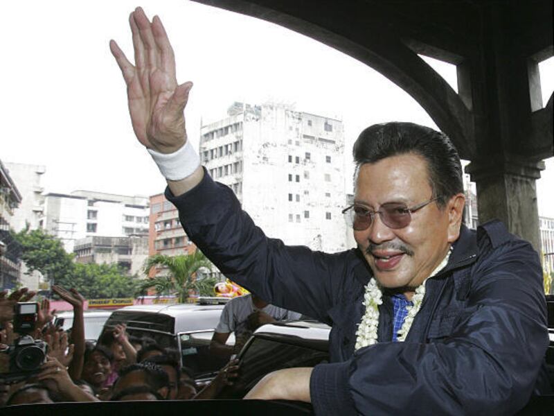 Former Philippine president and action movie star Joseph Estrada waves to fans as he attends a healing mass for cancer-stricken former President Corazon Aquino in Manila, Philippines. Estrada is returning to the big screen with his first film since he was