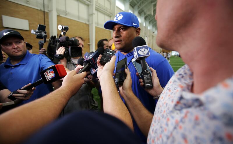 Head football coach Kalani Sitake talks with members of the media after BYU opened football practice at the indoor facility in Provo on Wednesday, July 31, 2019.