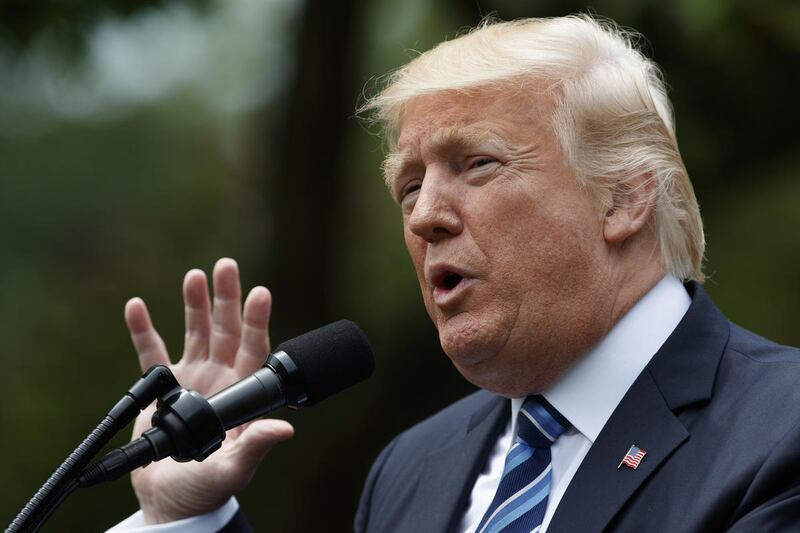 FILE - In this May 4, 2017 file photo, President Donald Trump speaks in the Rose Garden of the White House in Washington. Trump, in an apparent warning to his fired FBI director, said Friday, May 12, 2017, that James Comey had better hope there are no "ta