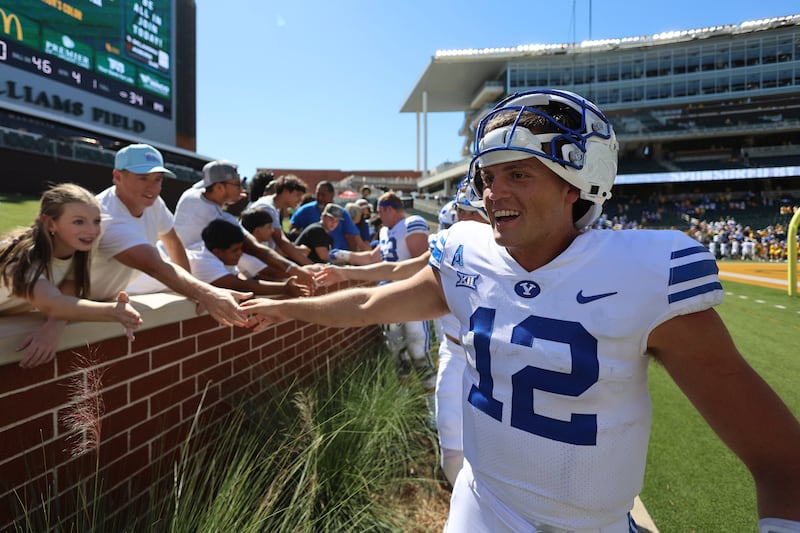 BYU quarterback Jake Retzlaff celebrates with fans after the win over Baylor Saturday, Sept. 28, 2024, in Waco, Texas. The 5-0 Cougars have a bye week.