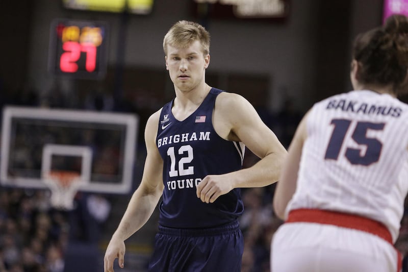 BYU forward Eric Mika (12) walks on the court during the first half of an NCAA college basketball game against Gonzaga in Spokane, Wash., Saturday, Feb. 25, 2017. (AP Photo/Young Kwak)