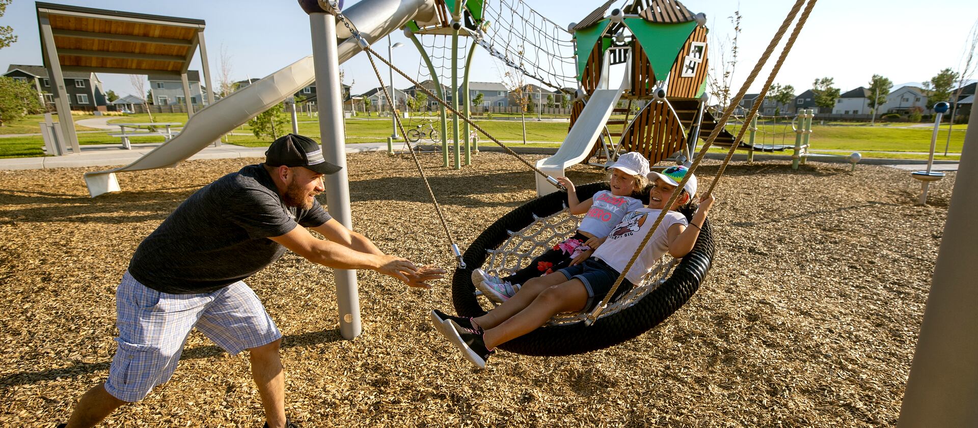 Braen Cublillos plays with his daughters Silvana Cubillos and Violeta Cubillos at a park in Vineyard, Utah.