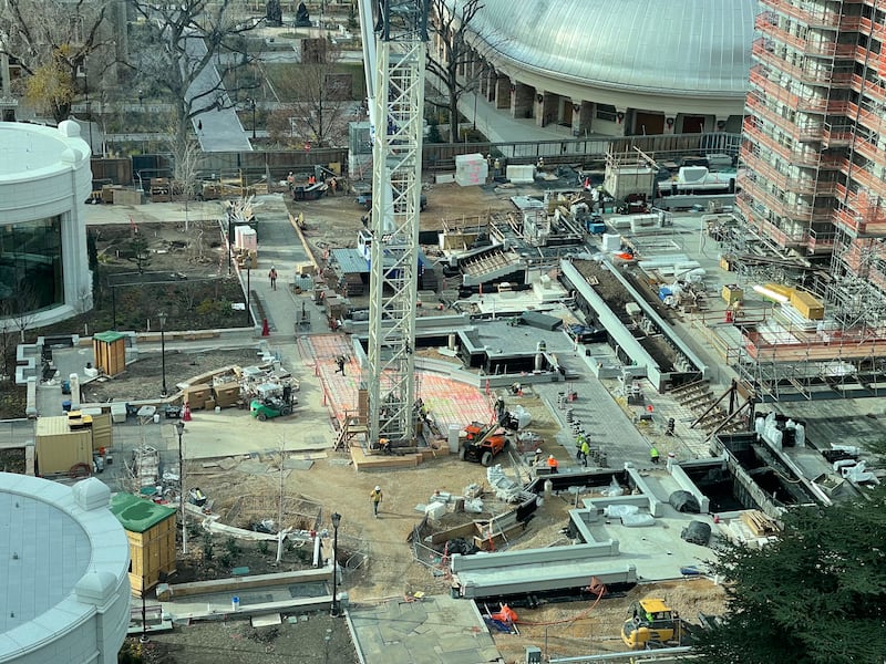 Construction crews work around the base of a crane on the grounds next to the Salt Lake Temple as renovation work continued Wednesday, Dec. 10, 2025.