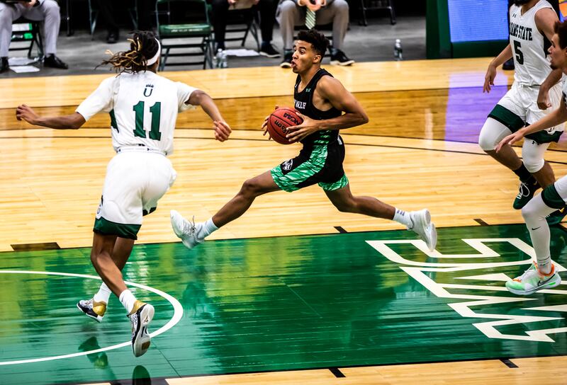Utah Valley guard Blaze Nield drives to the basket against Adam State in a game last season.