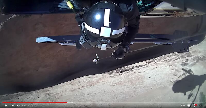 Rescuers lowered from the DPS helicopter into a slot canyon in Garfield County to hoist out 15 teens and two adults.