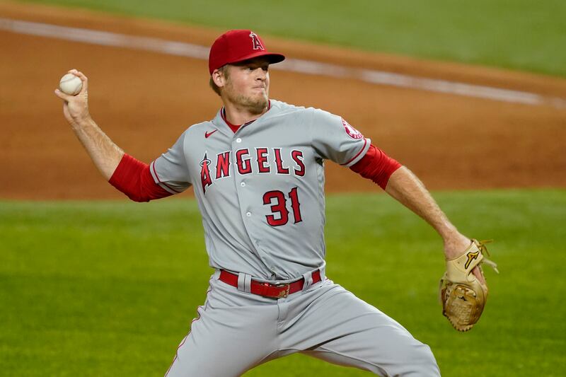 In this Sept. 10, 2020, file photo, Los Angeles Angels relief pitcher Ty Buttrey throws to a Texas Rangers batter during the ninth inning of a baseball game in Arlington, Texas. Buttrey has retired from baseball, saying he has lost his affection for the game.