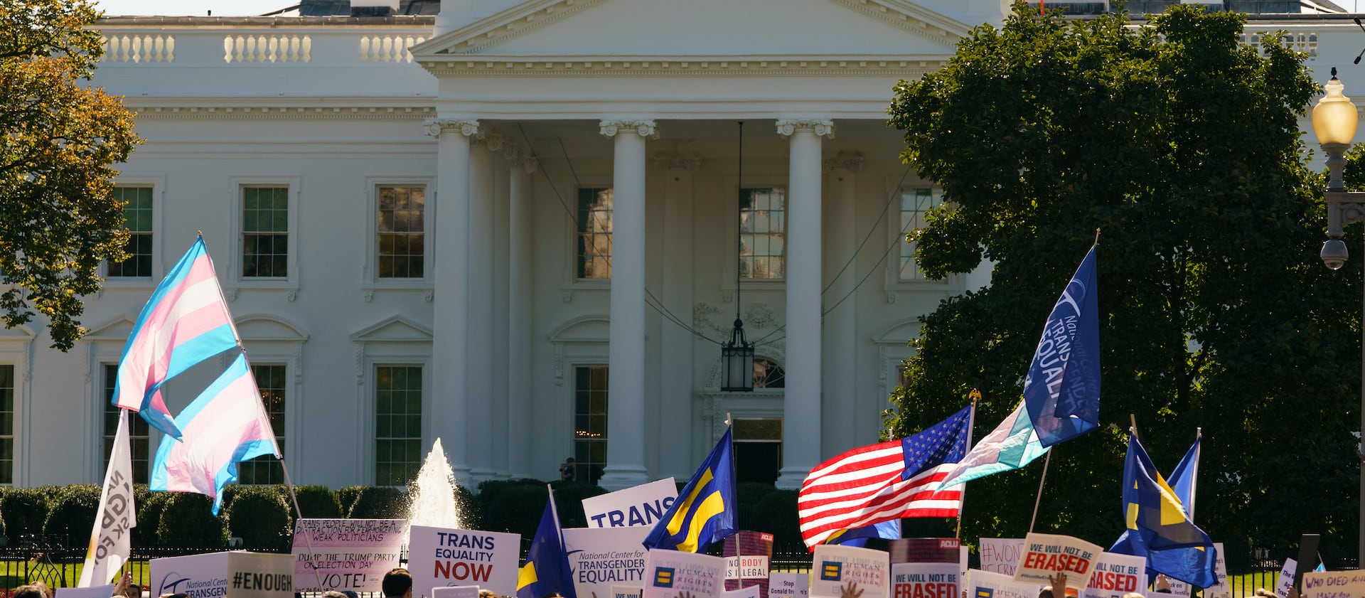 LGBTQ rights activists protest in front of the White House.