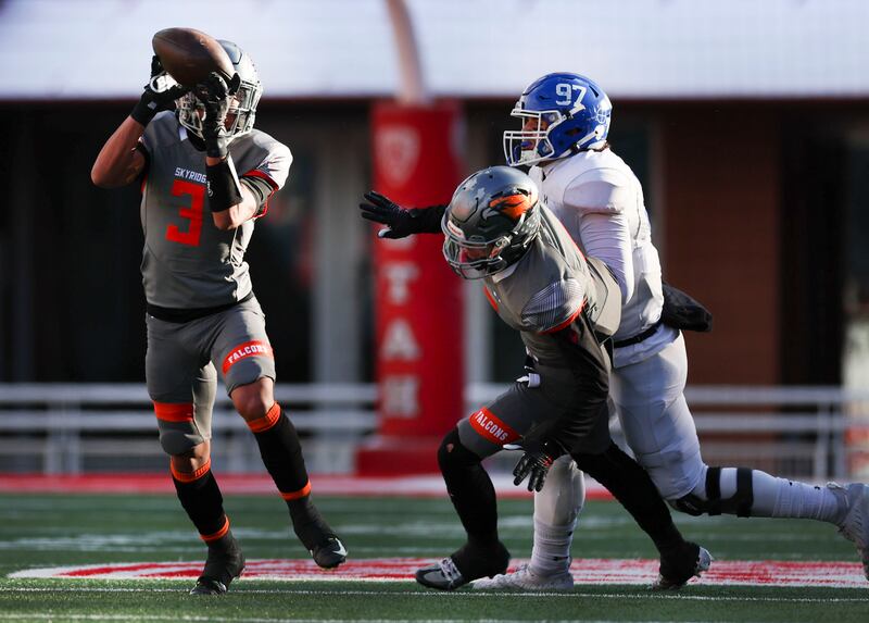 Skyridge’s Smith Snowden (3) intercepts a pass intended and returns it for a touchdown in the 6A state semifinal game at Rice-Eccles Stadium in Salt Lake City on Thursday, Nov. 10, 2022. Skyridge won 45-20.