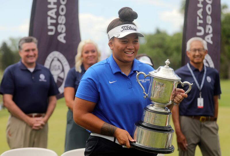 Lila Galea’i holds the trophy after winning the Women’s State Am at Oakridge Country Club in Farmington, Utah.