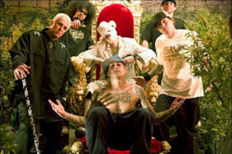 The Kottonmouth Kings are, clockwise from top right, DJ Bobby B, Pakelika, Lou Dog, Brad "Daddy" X, D-Loc and Richter.