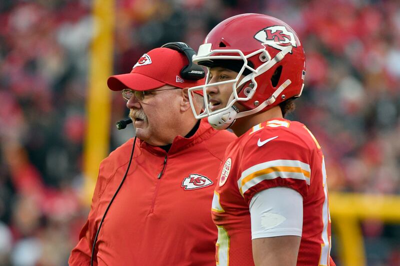 Kansas City Chiefs head coach Andy Reid and quarterback Patrick Mahomes (15) follow from the sidelines the first half of an NFL football game against the Oakland Raiders in Kansas City, Mo., Sunday, Dec. 30, 2018. (AP Photo/Ed Zurga)
