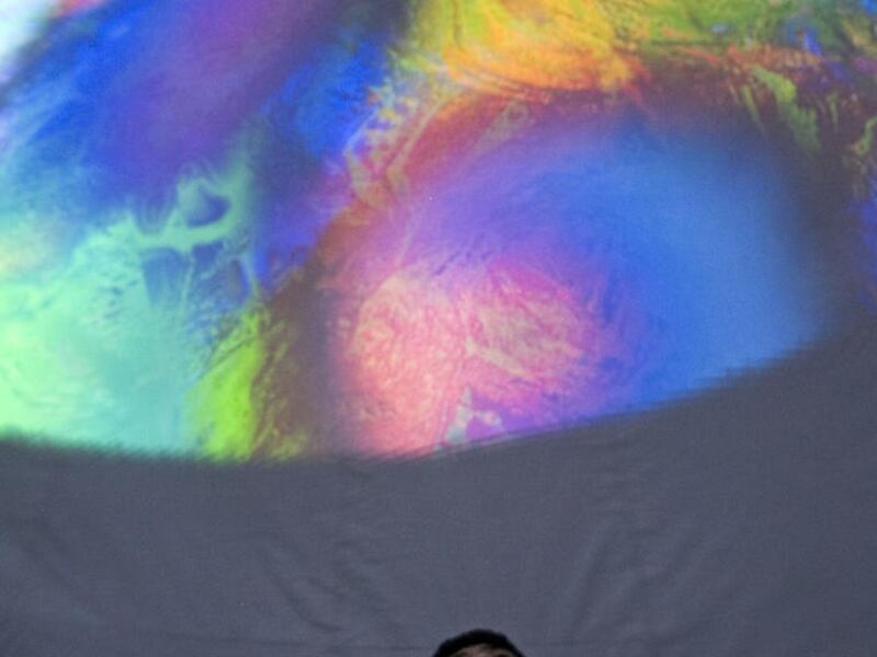 Devin McDougal (15) watches a light show in the Digistar 3 dome, an Evans & Sutherland Computer Corp. creation, which is geared to being highly visually stimulating eliminating the need for sound. Evans & Sutherland has appointed Jonathan Shaw as CEO an