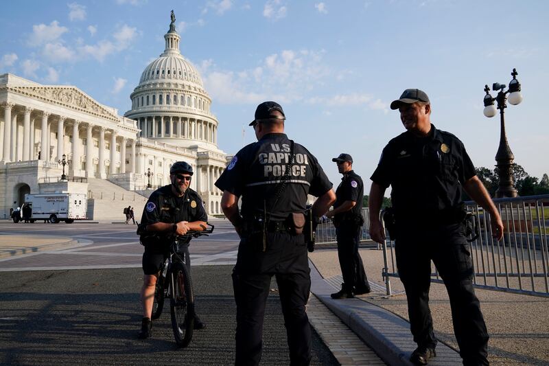 The U.S. Capitol is seen in Washington, early Tuesday, July 27, 2021, as U.S. Capitol Police keep eyes on the perimeter.