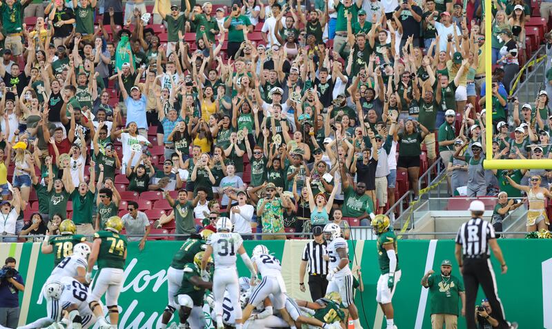 University of South Florida fans celebrate a rushing touchdown in the Bulls victory over BYU in Tampa, Florida, Oct. 12, 2019.