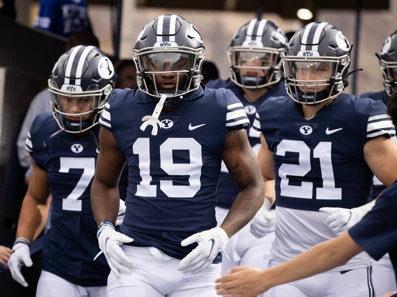 BYU’s Miles Davis (19) and teammates run onto the field prior to game against Idaho State. The Cougars will run on the field again Saturday night for their season opener vs. Sam Houston.