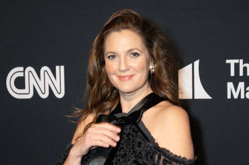 Drew Barrymore arrives on the red carpet for the 24th Annual Mark Twain Prize for American Humor at the Kennedy Center for the Performing Arts in Washington.