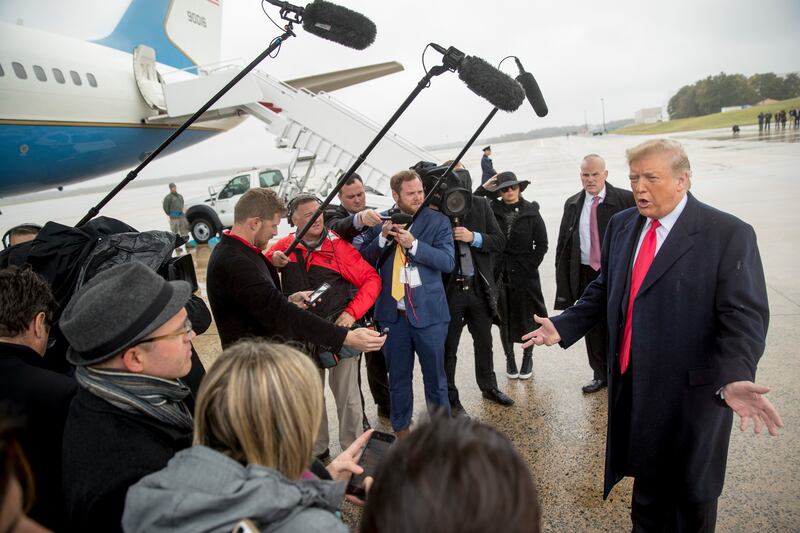 President Donald Trump speaks to reporters about a shooting at a Pittsburgh synagogue as he arrives at Air Force One at Andrews Air Force Base, Md., on Saturday, Oct. 27, 2018, to travel to Indianapolis to speak at the 91st Annual Future Farmers of Americ