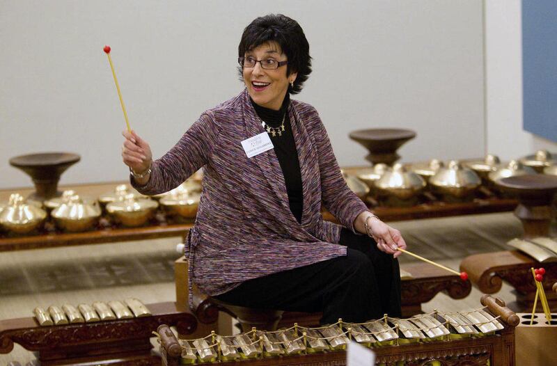 In this Jan. 18, 2012 photo, Eunice Goldberg of Chandler plays an Indonesian percussion instrument at the Musical Instrument Museum in Phoenix. Metropolitan Phoenix museums realize they have to do more to attract Hispanic visitors and are launching effort