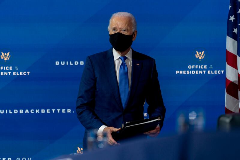 President-elect Joe Biden departs a news conference after introducing his nominees and appointees to economic policy posts at The Queen theater, Tuesday, Dec. 1, 2020, in Wilmington, Del.