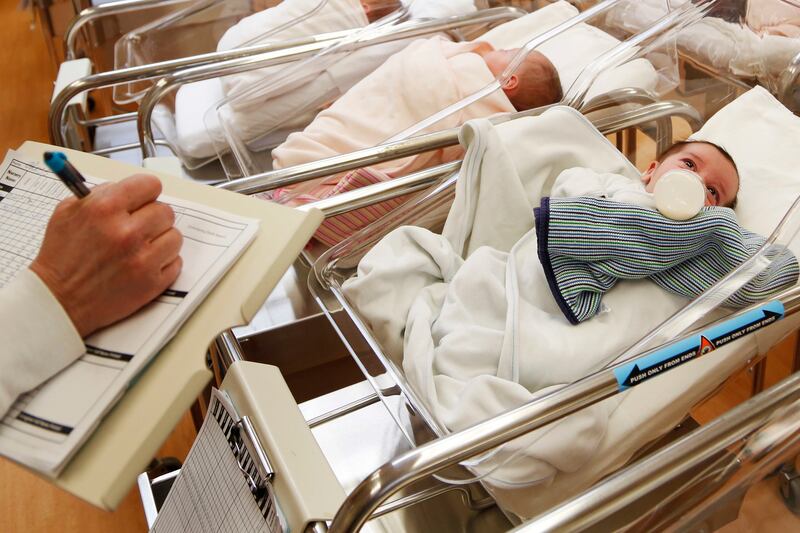 FILE - This Feb. 16, 2017 file photo shows newborn babies in the nursery of a postpartum recovery center in upstate New York. Women in the United States gave birth last year at the lowest rate in three decades, a trend that could weigh on economic growth