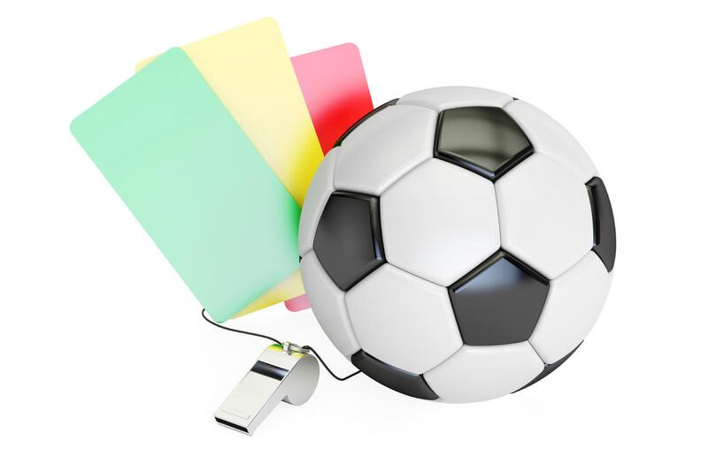 Football concept with green, red, yellow card and whistle.