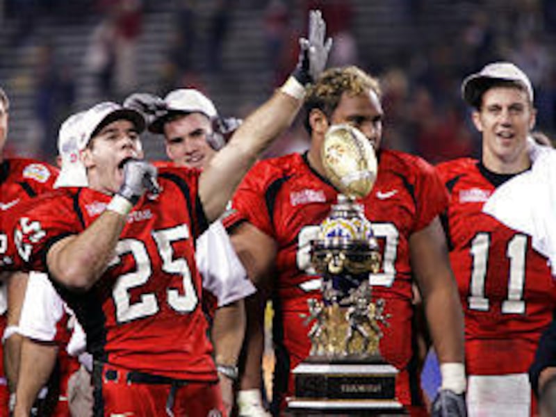 From left, Morgan Scalley, Sione Pouha and Alex Smith celebrate the Utes' 35-7 Fiesta Bowl win against Pittsburgh on Saturday night in the Fiesta Bowl. Utah ended the season with an undefeated, 12-0 mark.